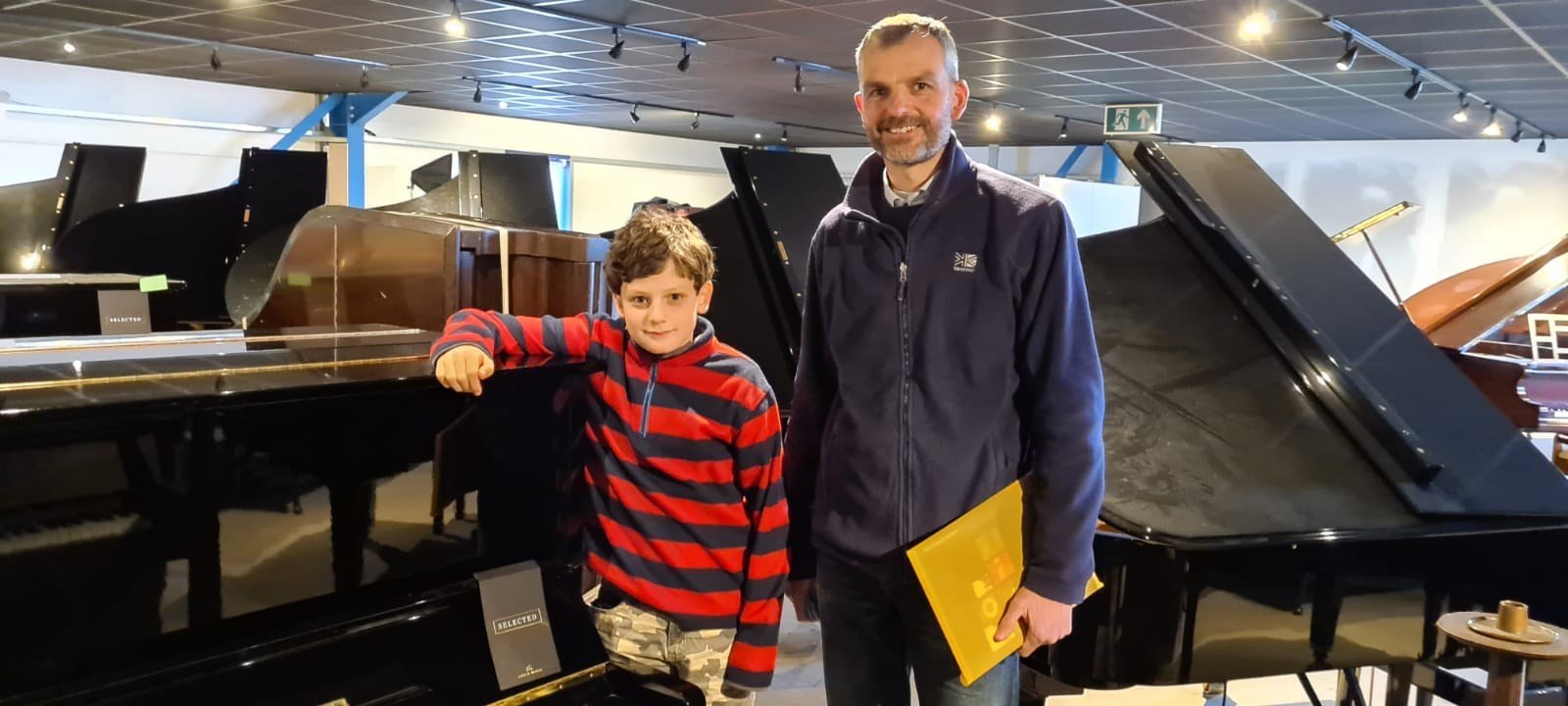 Kid with piano teacher